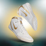 Nike Freek Wrestling Shoes in White and Gold hero image